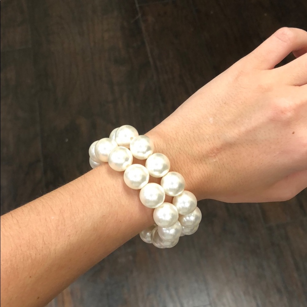 Matching pearl bracelets.